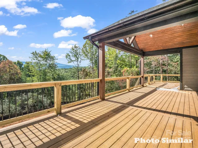 a view of balcony with wooden floor