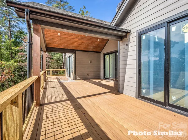 a view of a balcony with wooden floor and floor