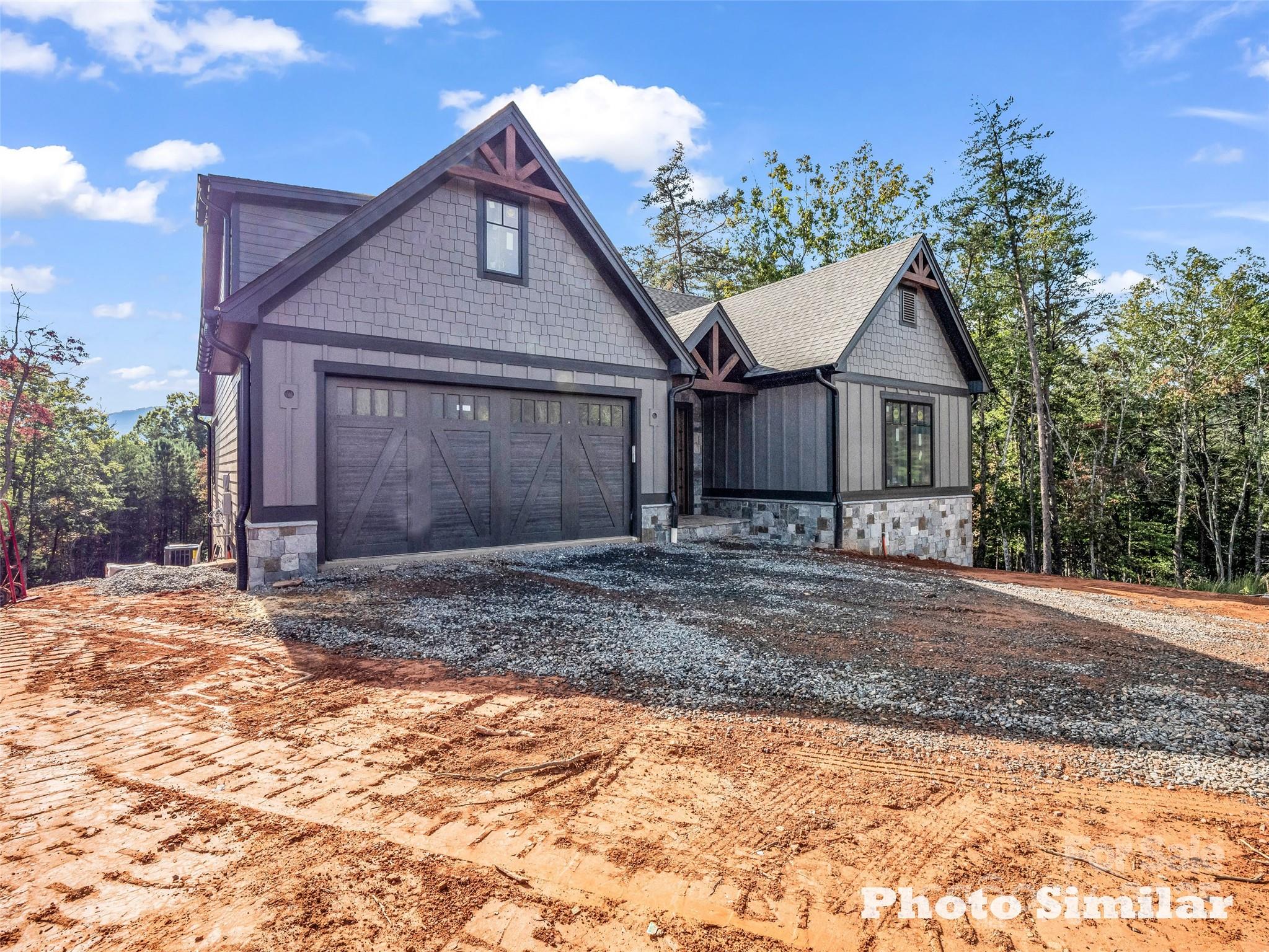1 Jackson Ridge Ln Mill Spring Mill Spring, NC 28756 - Photo 5 of 36 a front view of a house with garden