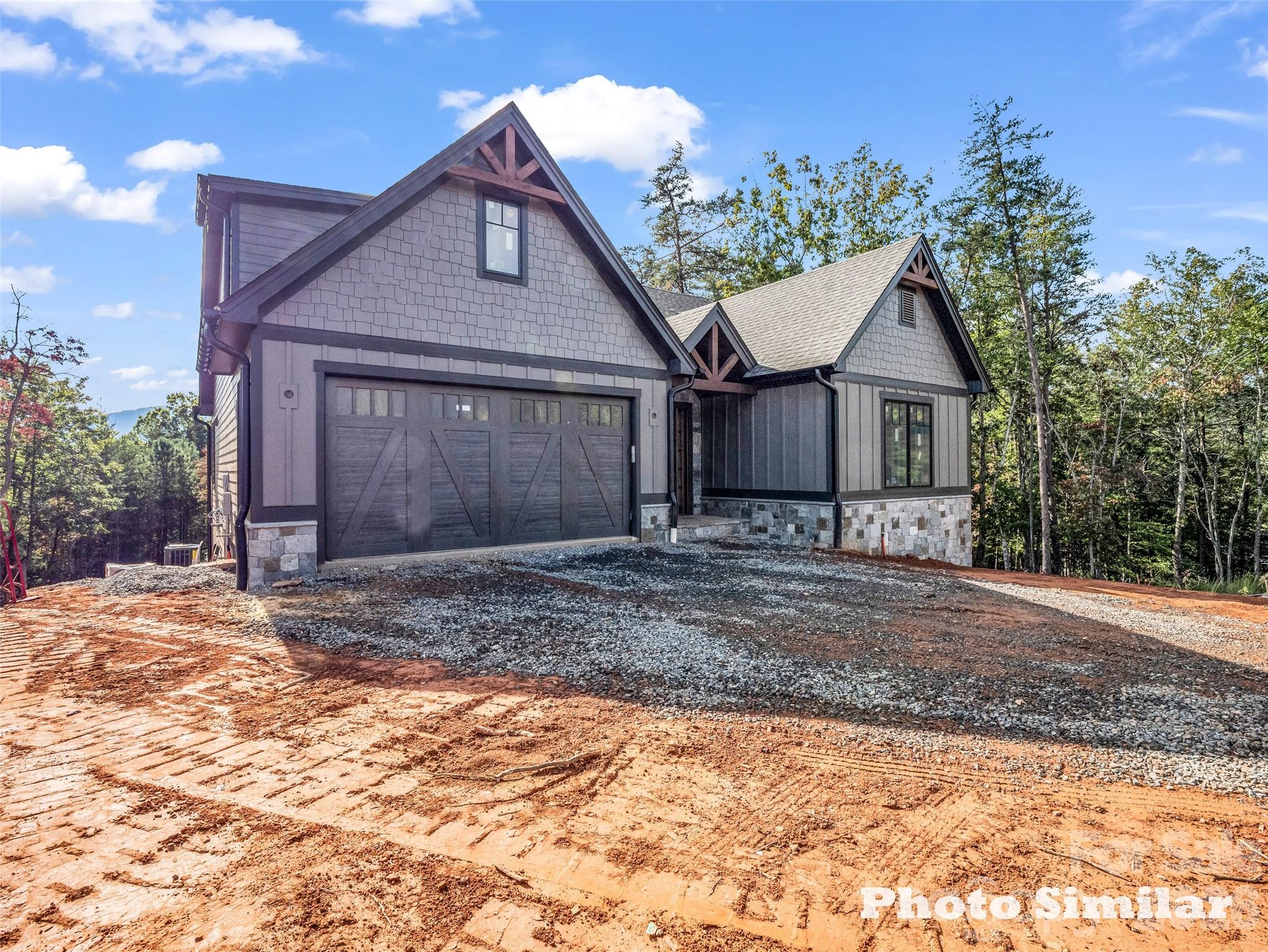 1 Jackson Ridge Ln Mill Spring Mill Spring, NC 28756 - Photo 5 of 43 a front view of a house with garden