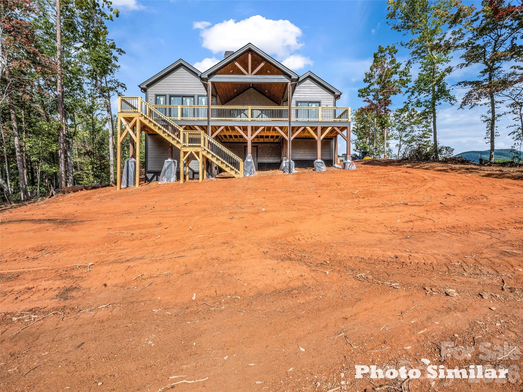 1 Jackson Ridge Ln Mill Spring Mill Spring, NC 28756 - Photo 7 of 43 a front view of a house with a yard