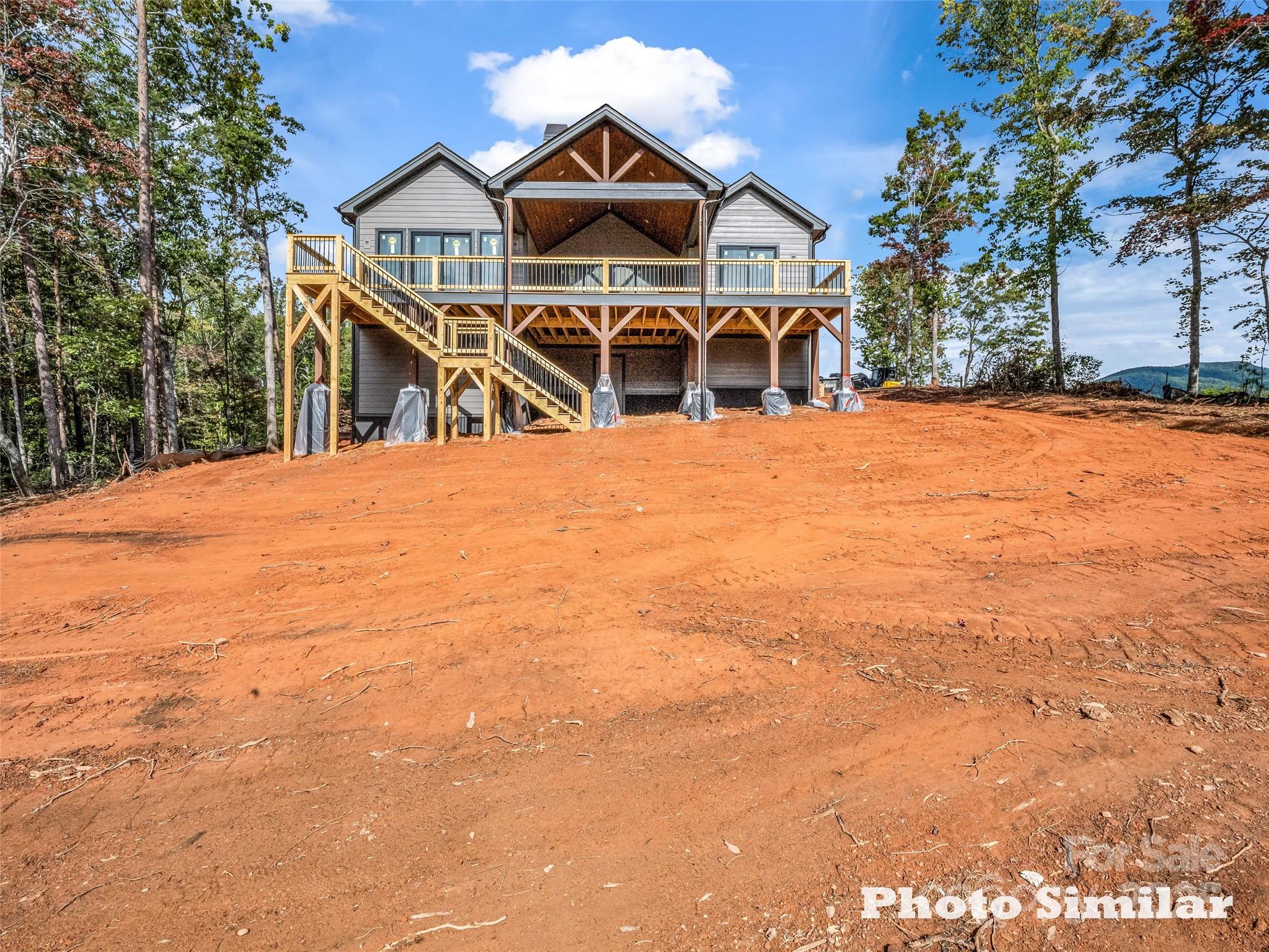 1 Jackson Ridge Ln Mill Spring Mill Spring, NC 28756 - Photo 7 of 36 a front view of a house with a yard
