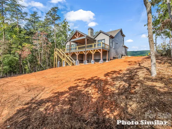 a view of houses with a street