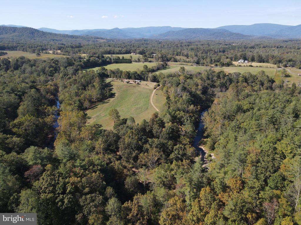 180 5 Forks Road Woodville, VA 22749 - Photo 3 of 44 an aerial view of residential house with outdoor space and trees
