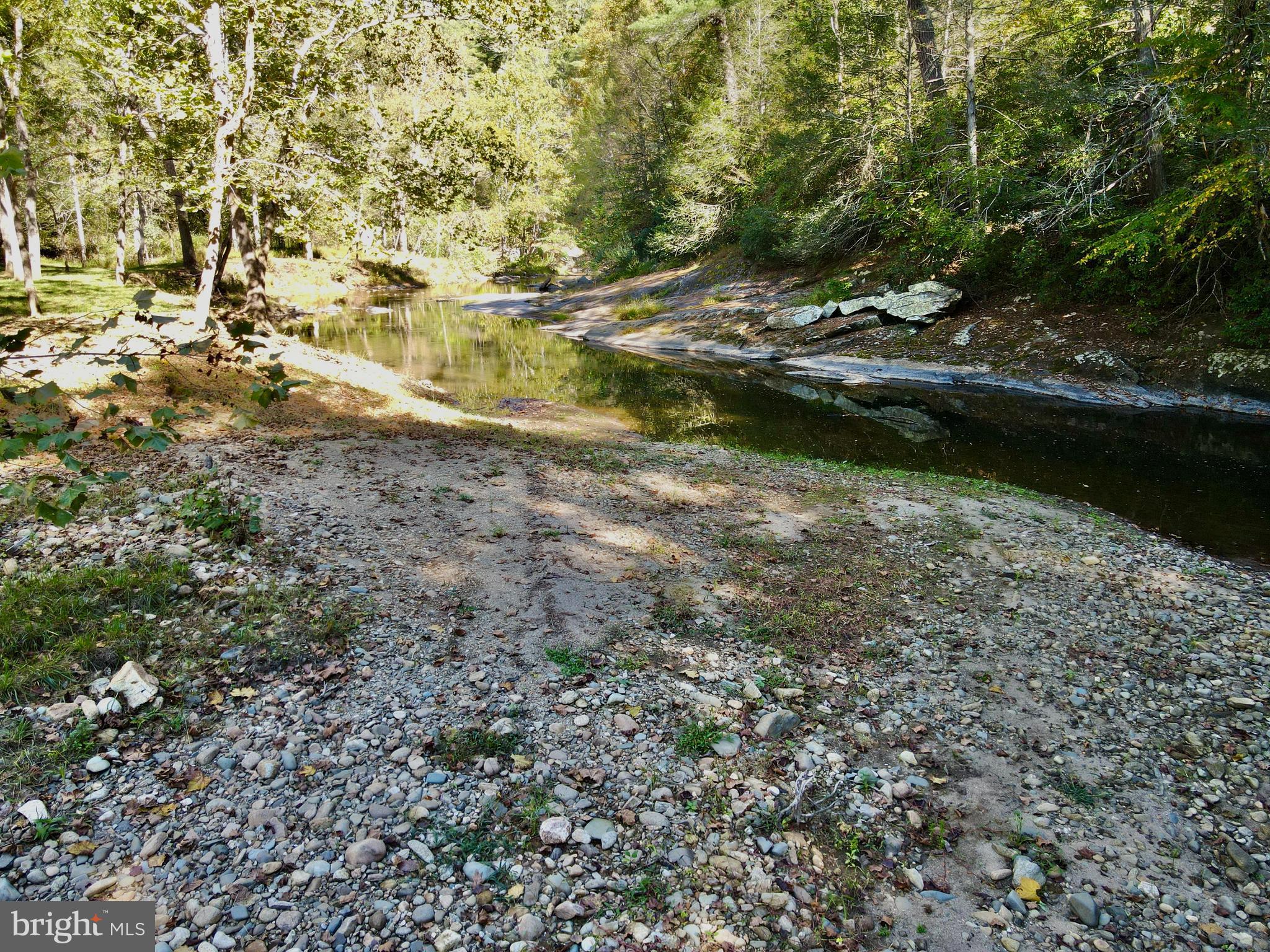 180 5 Forks Road Woodville, VA 22749 - Photo 35 of 44 a view of a lake with houses