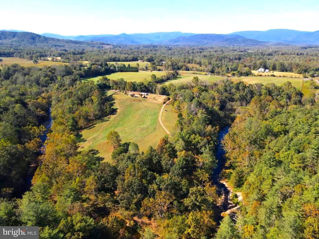 180 5 Forks Road Woodville, VA 22749 - Photo 41 of 44 an aerial view of residential houses with outdoor space and trees
