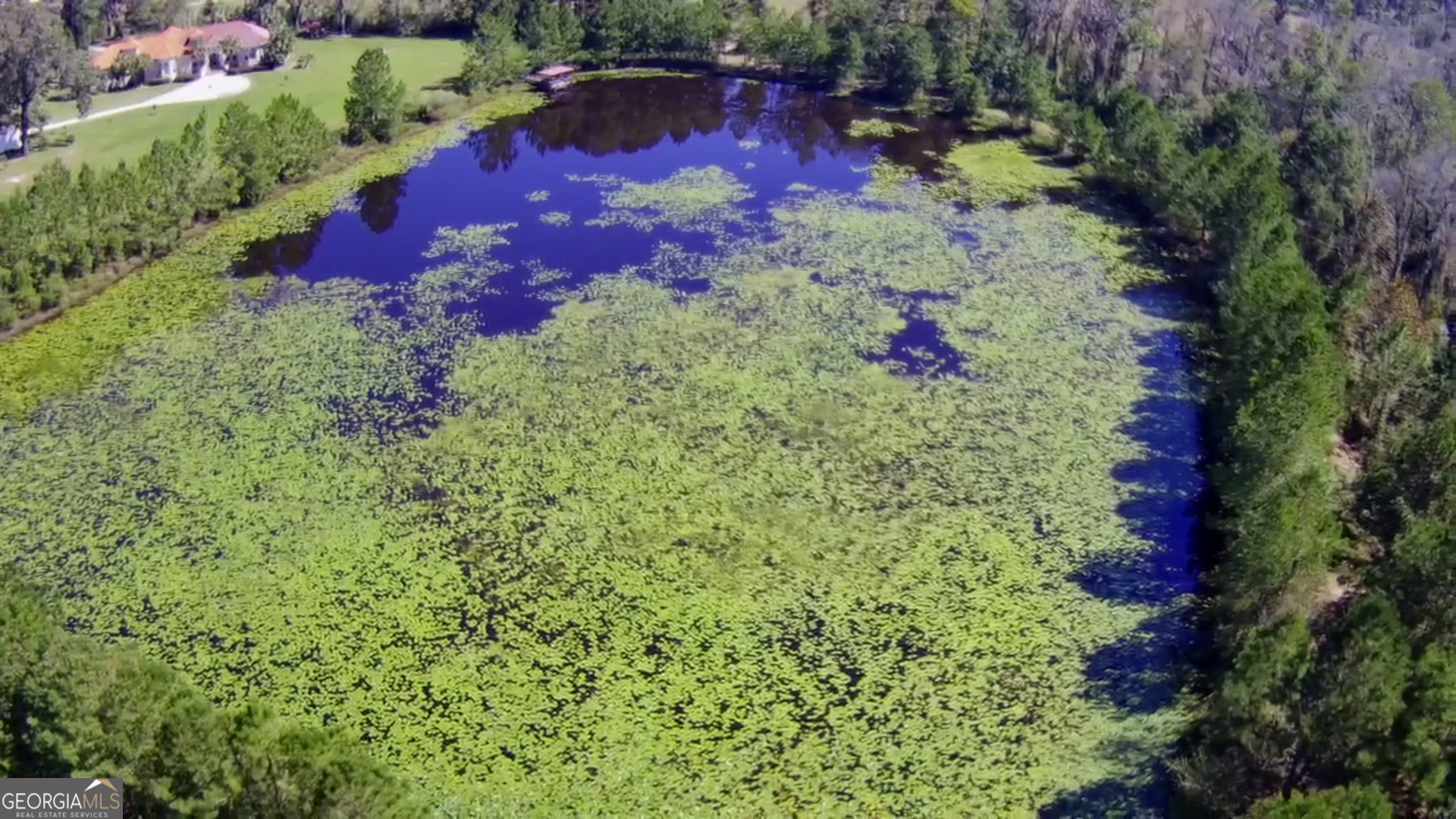 an aerial view of house with yard