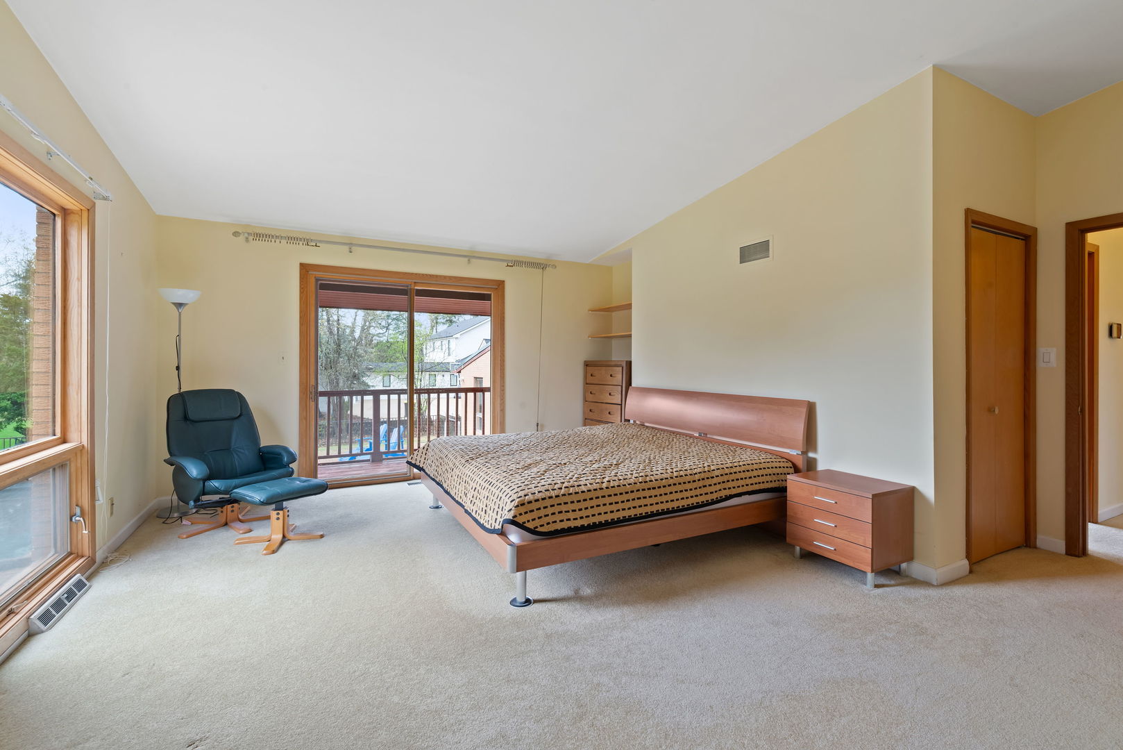 2819 Meyers Road Oak Brook, IL 60523 - Photo 18 of 35 a bedroom with a bed and large windows