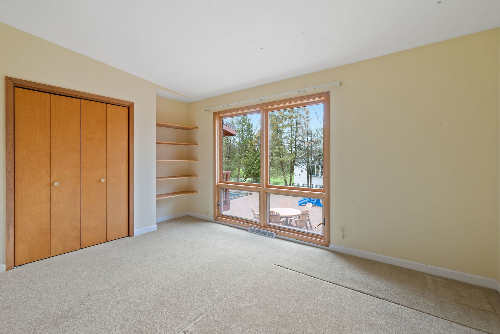 2819 Meyers Road Oak Brook, IL 60523 - Photo 24 of 35 a view of an empty room with a fireplace and a window