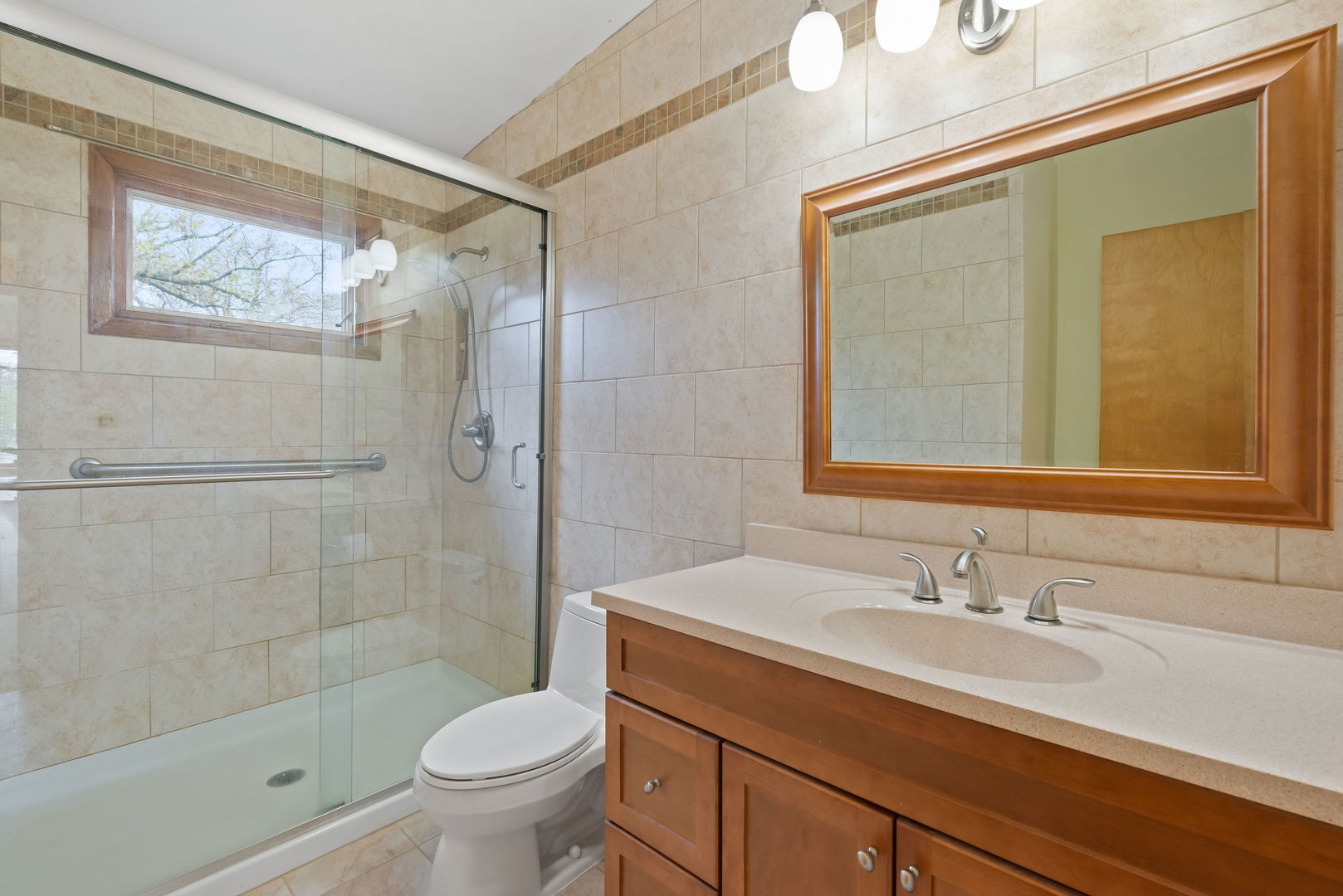 2819 Meyers Road Oak Brook, IL 60523 - Photo 26 of 35 a bathroom with a granite countertop sink a toilet and shower