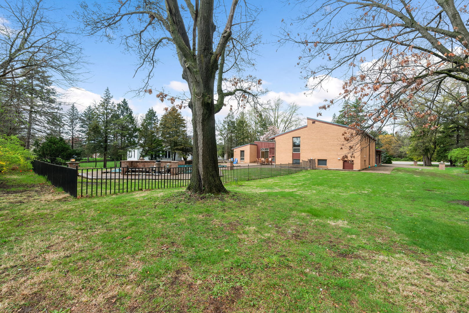 2819 Meyers Road Oak Brook, IL 60523 - Photo 31 of 35 a view of a white house with a big yard and large tree