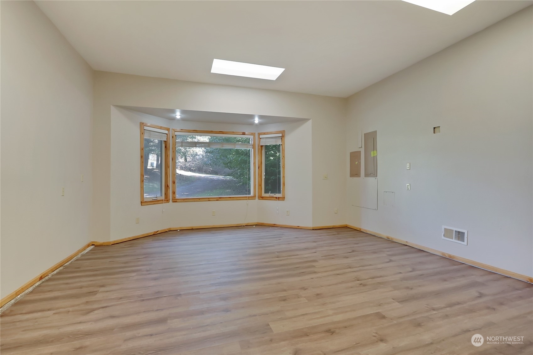 20606 Edwards Road East Lake Tapps, WA 98391 - Photo 9 of 40 wooden floor in an empty room with a window