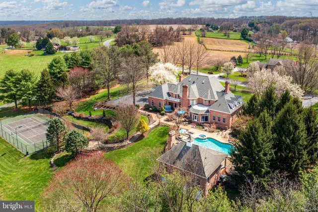 an aerial view of a house with a lake view