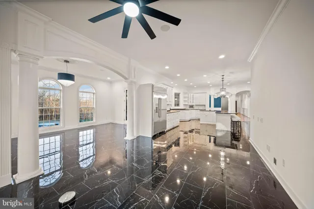 a kitchen with granite countertop kitchen island stainless steel appliances a sink and a center island