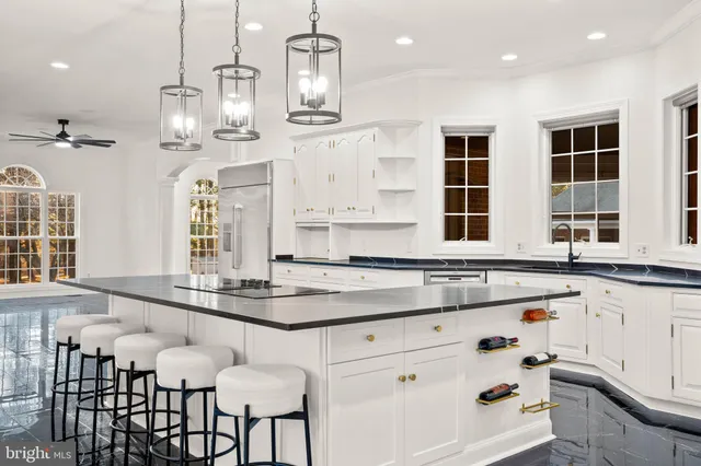 an aerial view of a house with yard swimming pool and outdoor seating