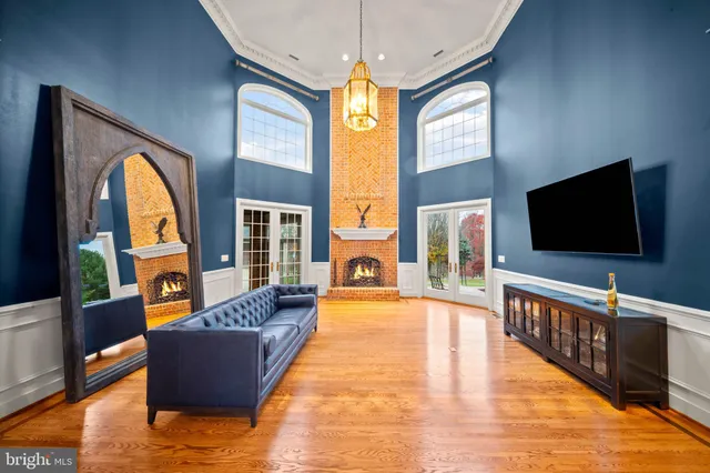 a living room with fireplace furniture and a flat screen tv