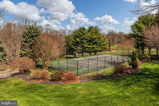 a living room with fireplace furniture and a flat screen tv