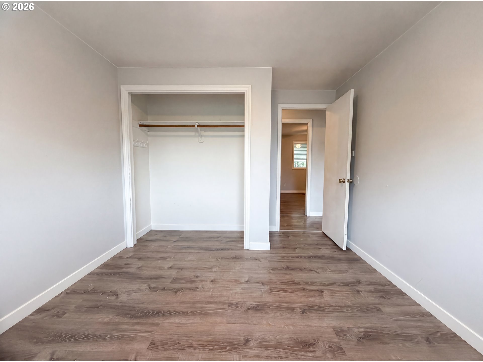 1209 Southwest 25th Street Troutdale, OR 97060 - Photo 6 of 16 a view of an empty room with closet and a window