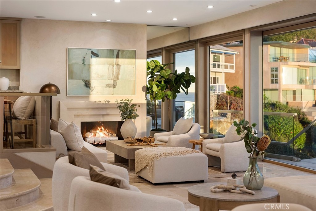 1907 Ocean Way Laguna Beach, CA 92651 - Photo 17 of 74 a living room with furniture fireplace and a large window