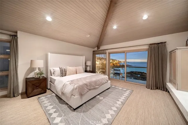 a dining room with furniture and a floor to ceiling window