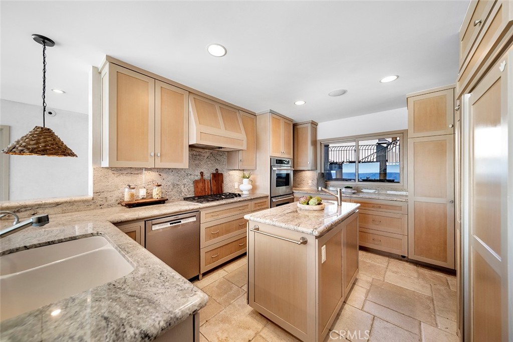 1907 Ocean Way Laguna Beach, CA 92651 - Photo 35 of 74 a kitchen with a sink stove and refrigerator