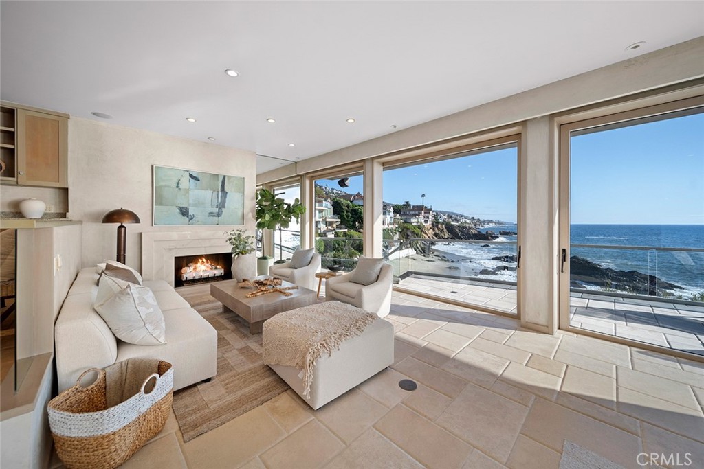 1907 Ocean Way Laguna Beach, CA 92651 - Photo 41 of 74 a living room with furniture and a floor to ceiling window