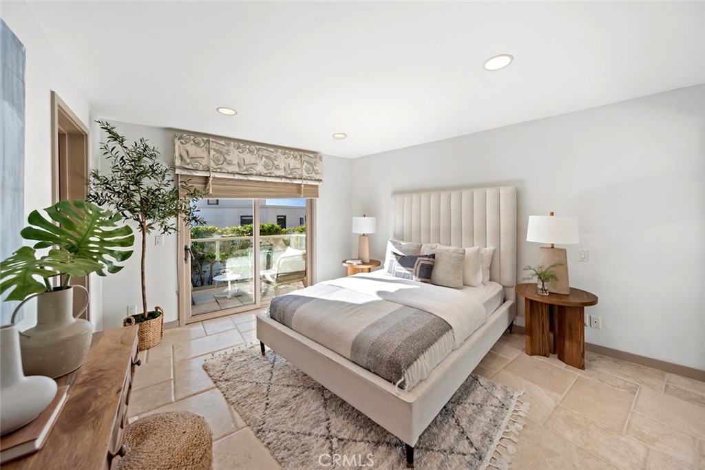 1907 Ocean Way Laguna Beach, CA 92651 - Photo 43 of 74 a bedroom with a bed table flowerpot and window
