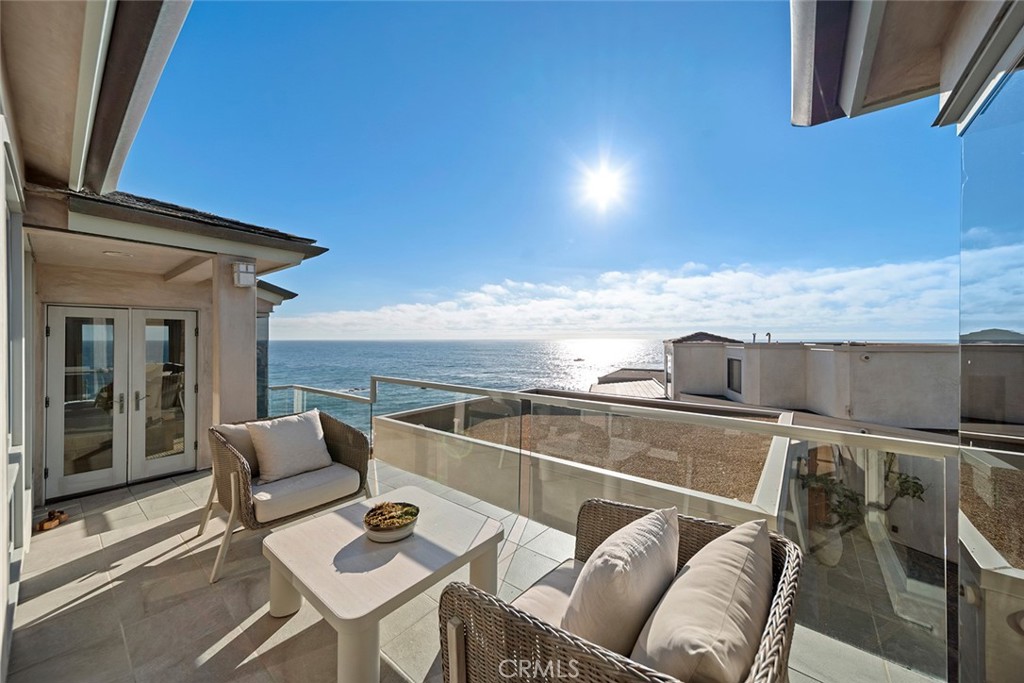 1907 Ocean Way Laguna Beach, CA 92651 - Photo 49 of 74 a view of a balcony with dining table and chairs