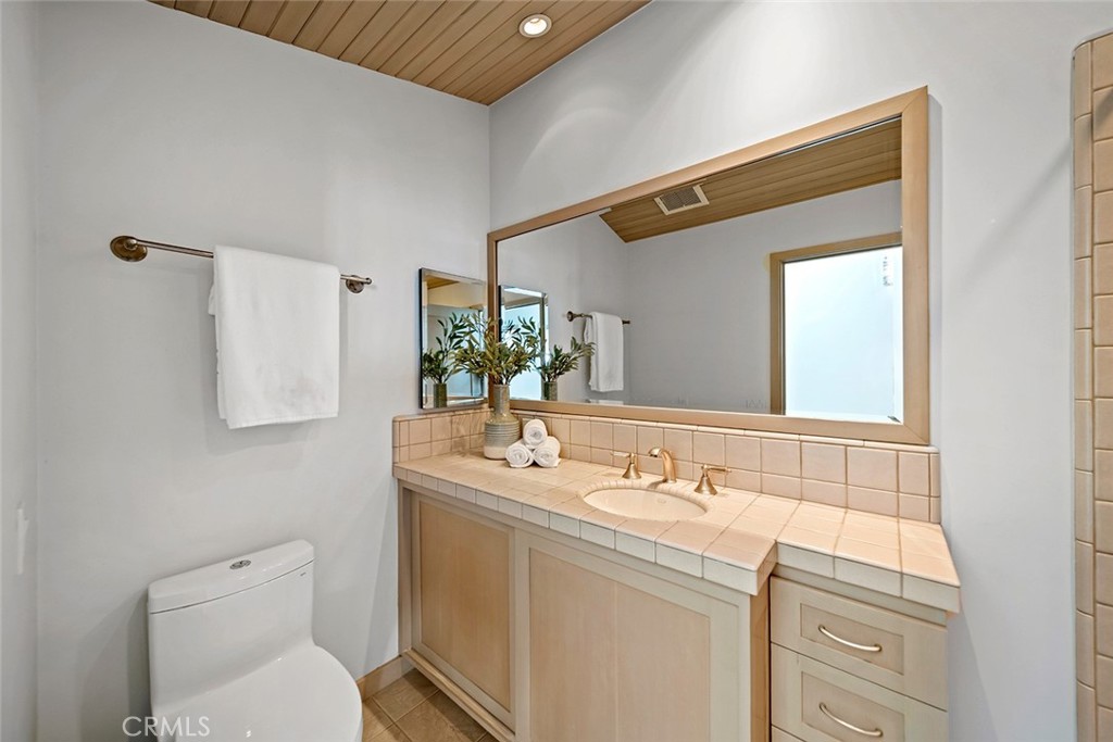 1907 Ocean Way Laguna Beach, CA 92651 - Photo 52 of 74 a bathroom with a sink and a mirror