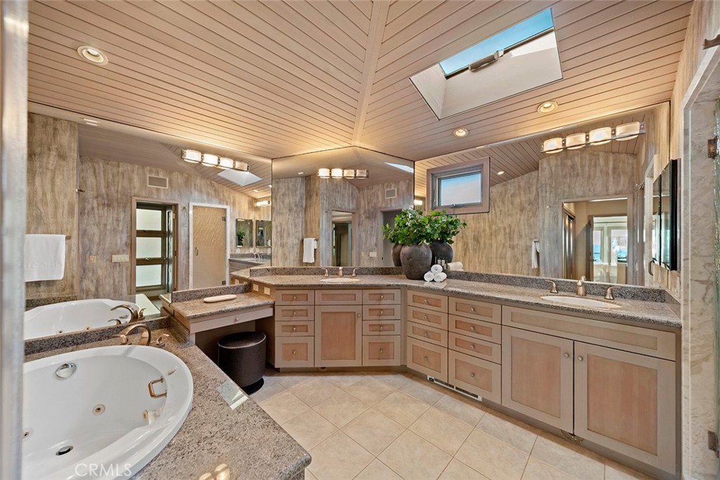 1907 Ocean Way Laguna Beach, CA 92651 - Photo 54 of 74 a large bathroom with a large tub and sink