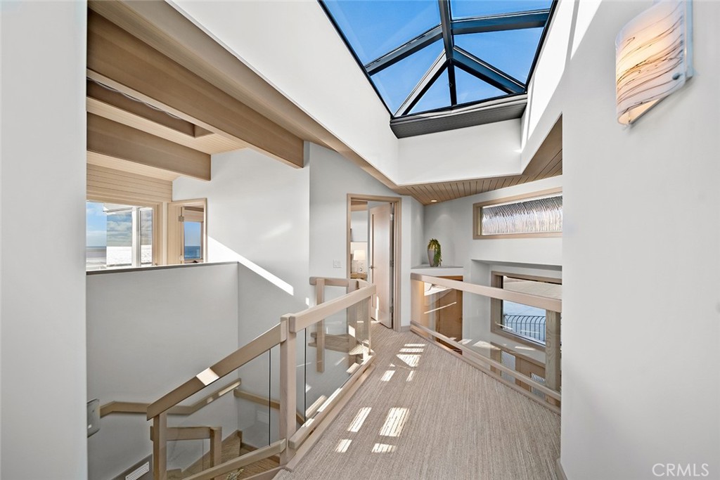 1907 Ocean Way Laguna Beach, CA 92651 - Photo 58 of 74 a view of a hallway with wooden floor and staircase