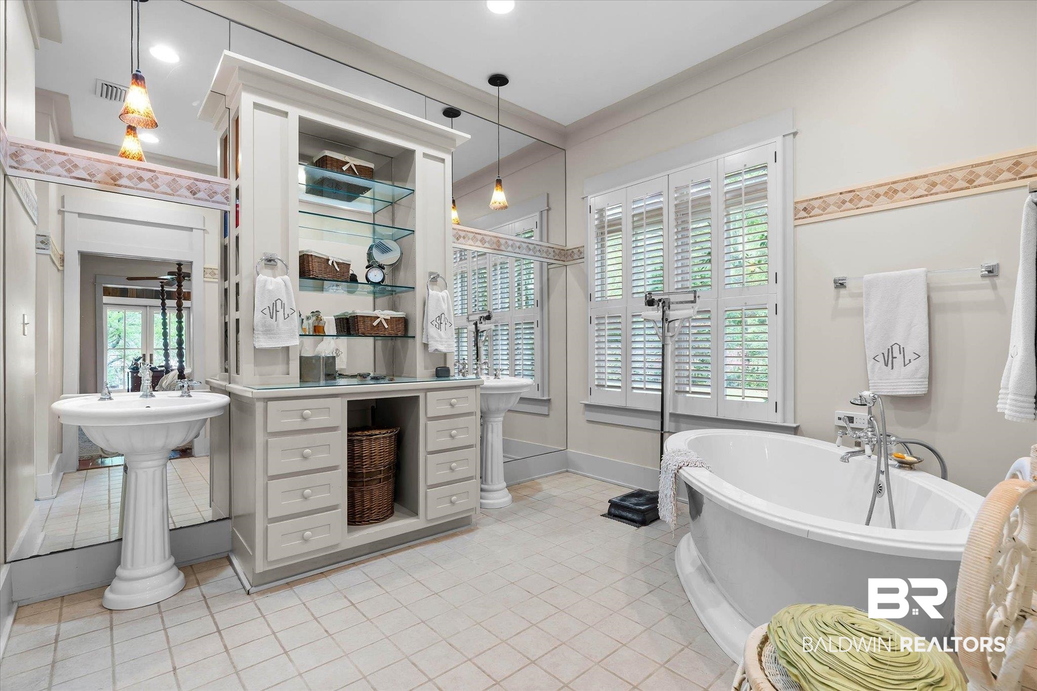 2300 Burgett Road Mobile, AL 36605 - Photo 16 of 40 Full bathroom featuring ornamental molding, light tile patterned floors, and a freestanding tub