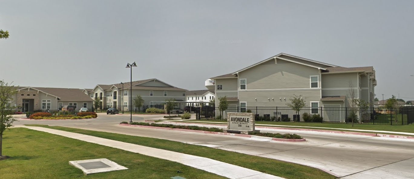 13101 Avondale Farms Road, Unit 15 Fort Worth, TX 76052 - Photo 1 of 6 a view of a building with a view of street