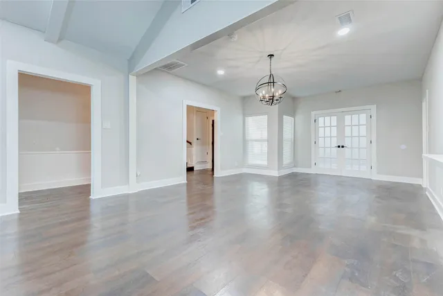 a large kitchen with cabinets stainless steel appliances and a counter space