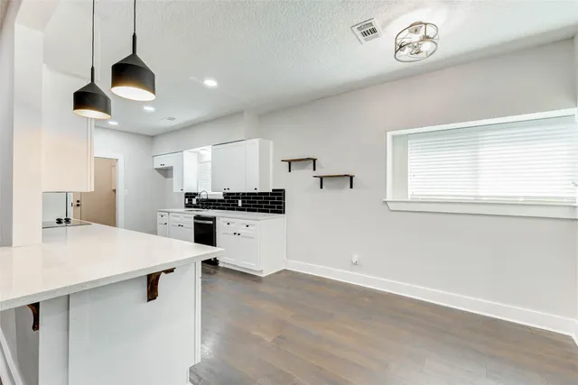 a room with a bed and a window