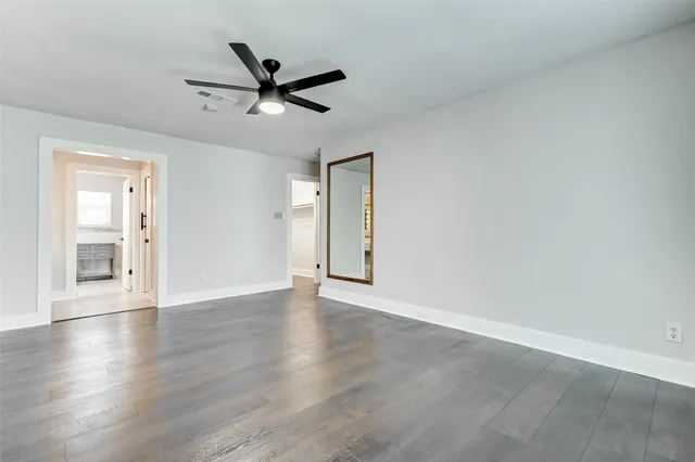 a white toilet sitting next to a bathroom sink