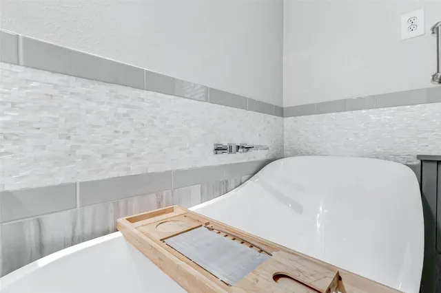 a close view of a sink a mirror and city view