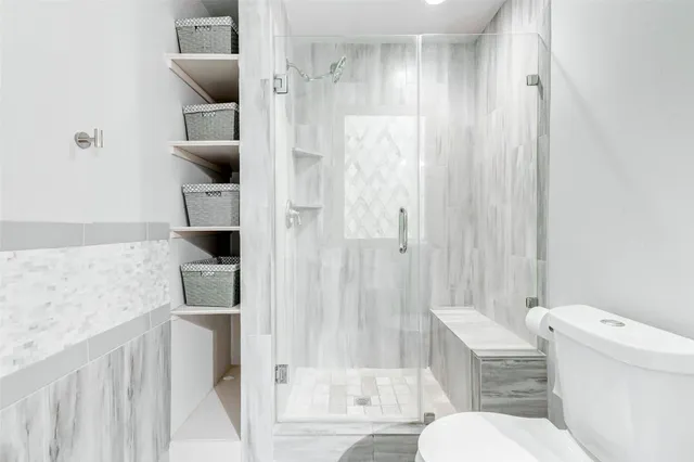 a view of a wooden deck with furniture