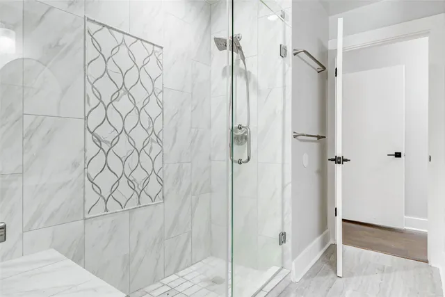 a view of a wooden bench on the roof deck