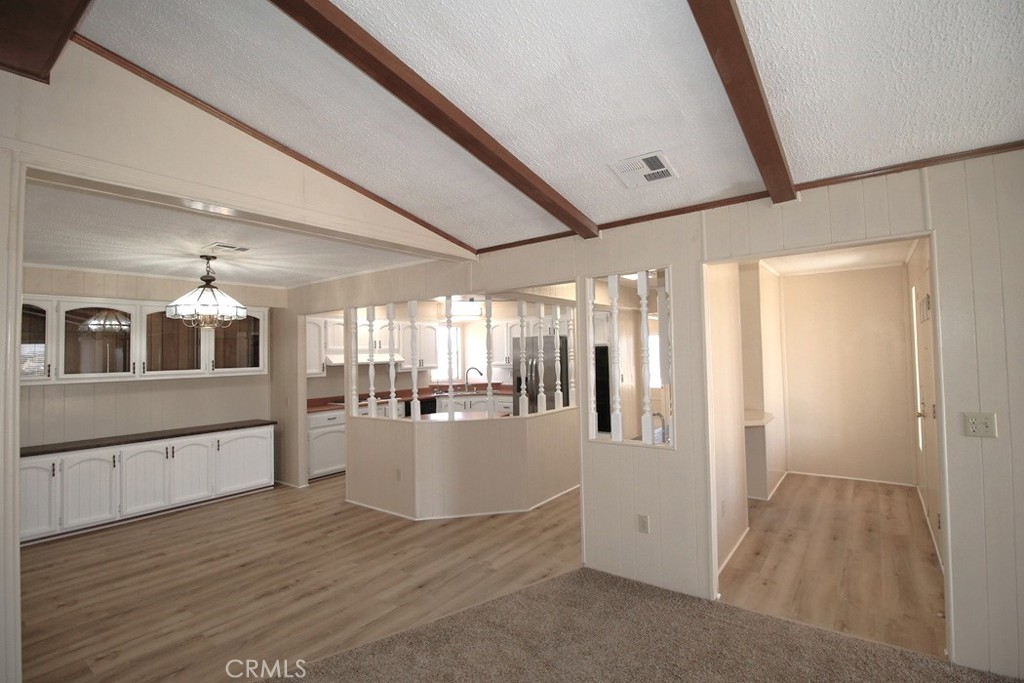 3750 Main Street Barstow, CA 92311 - Photo 15 of 39 a view of a hallway with wooden floors