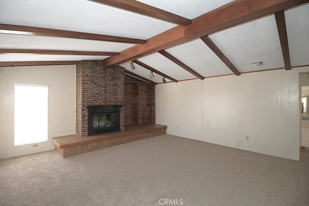 3750 Main Street Barstow, CA 92311 - Photo 25 of 39 a view of empty room with a fireplace