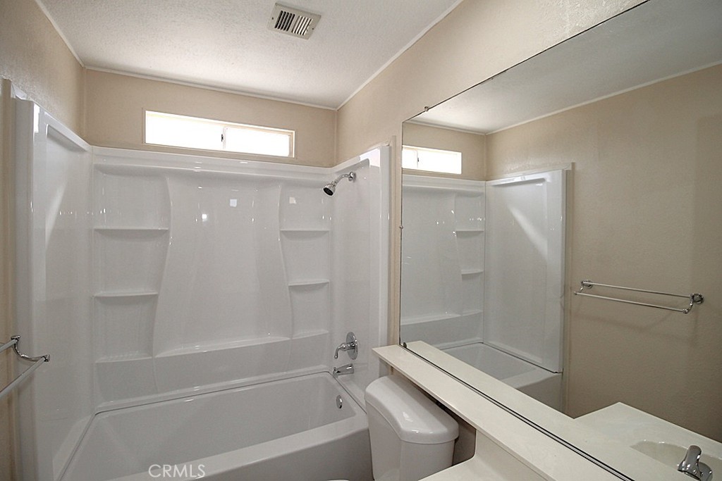 3750 Main Street Barstow, CA 92311 - Photo 31 of 39 a bathroom with a shower and a toilet