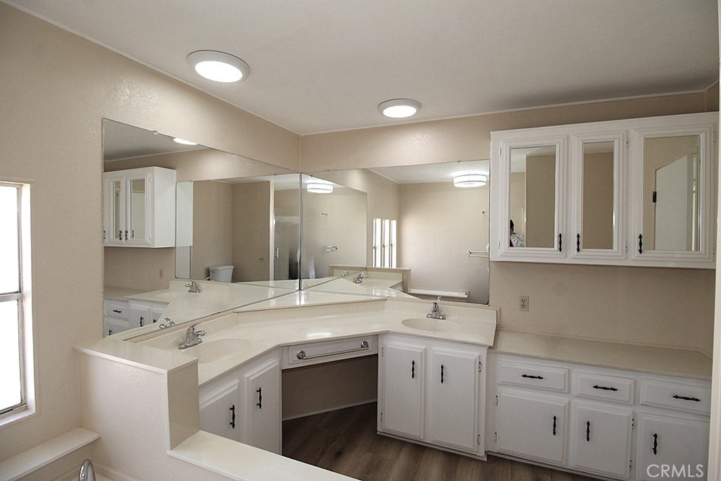 3750 Main Street Barstow, CA 92311 - Photo 38 of 39 a kitchen with a sink stove and cabinets