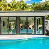 a view of swimming pool with a patio