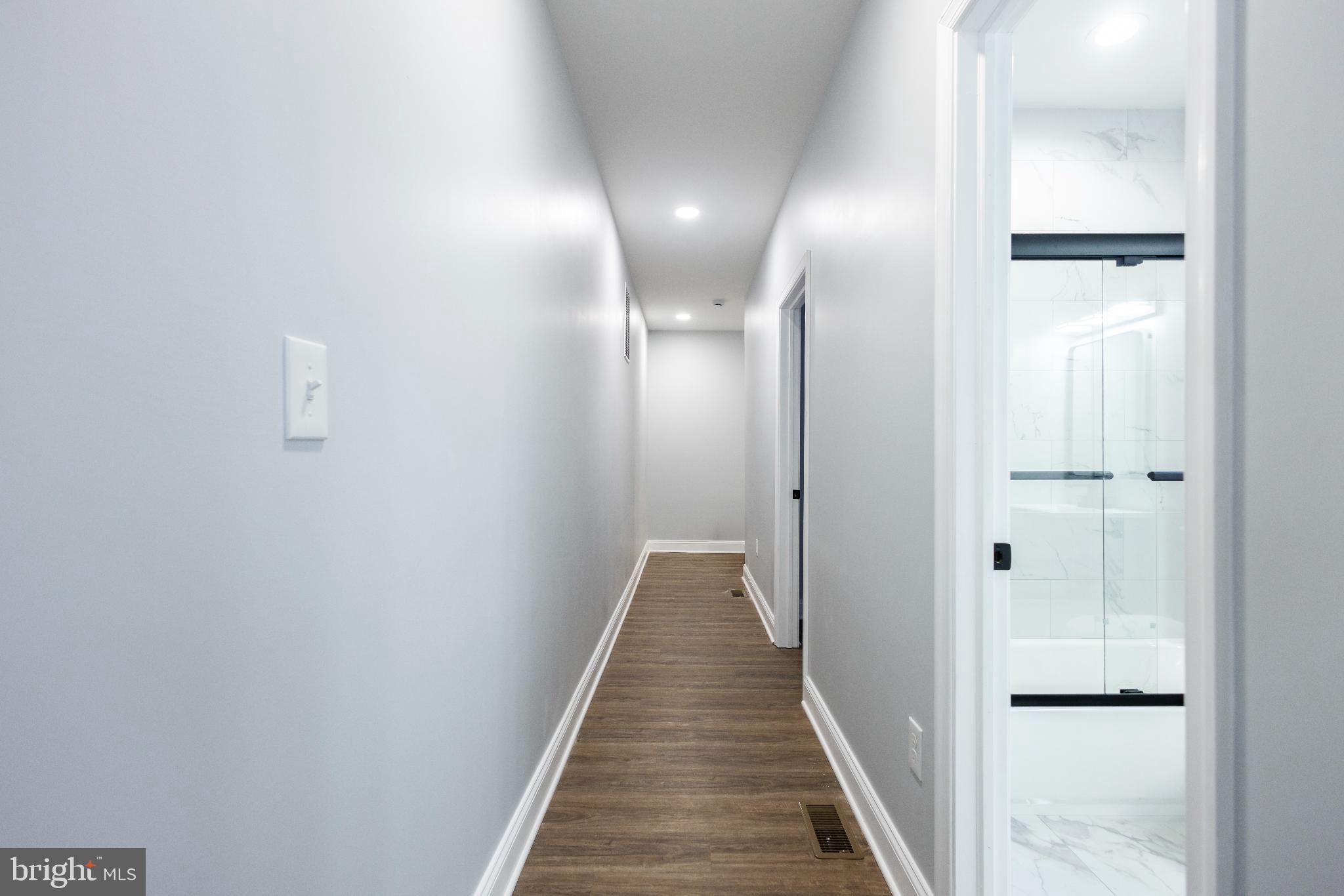 820 North Monroe Street Baltimore, MD 21217 - Photo 11 of 23 a view of a hallway with wooden floor