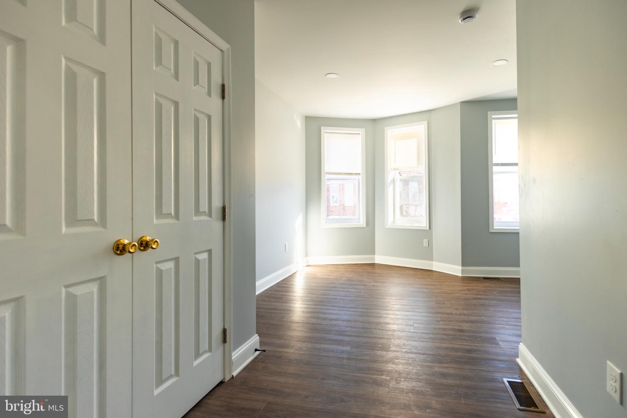 820 North Monroe Street Baltimore, MD 21217 - Photo 13 of 23 a view of an empty room with wooden floor