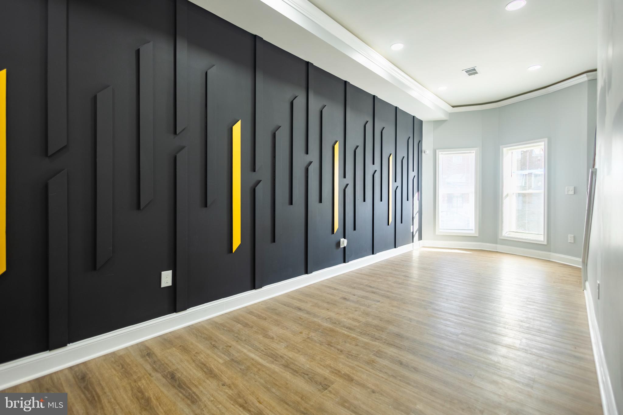 820 North Monroe Street Baltimore, MD 21217 - Photo 5 of 23 a view of an empty room with wooden floor