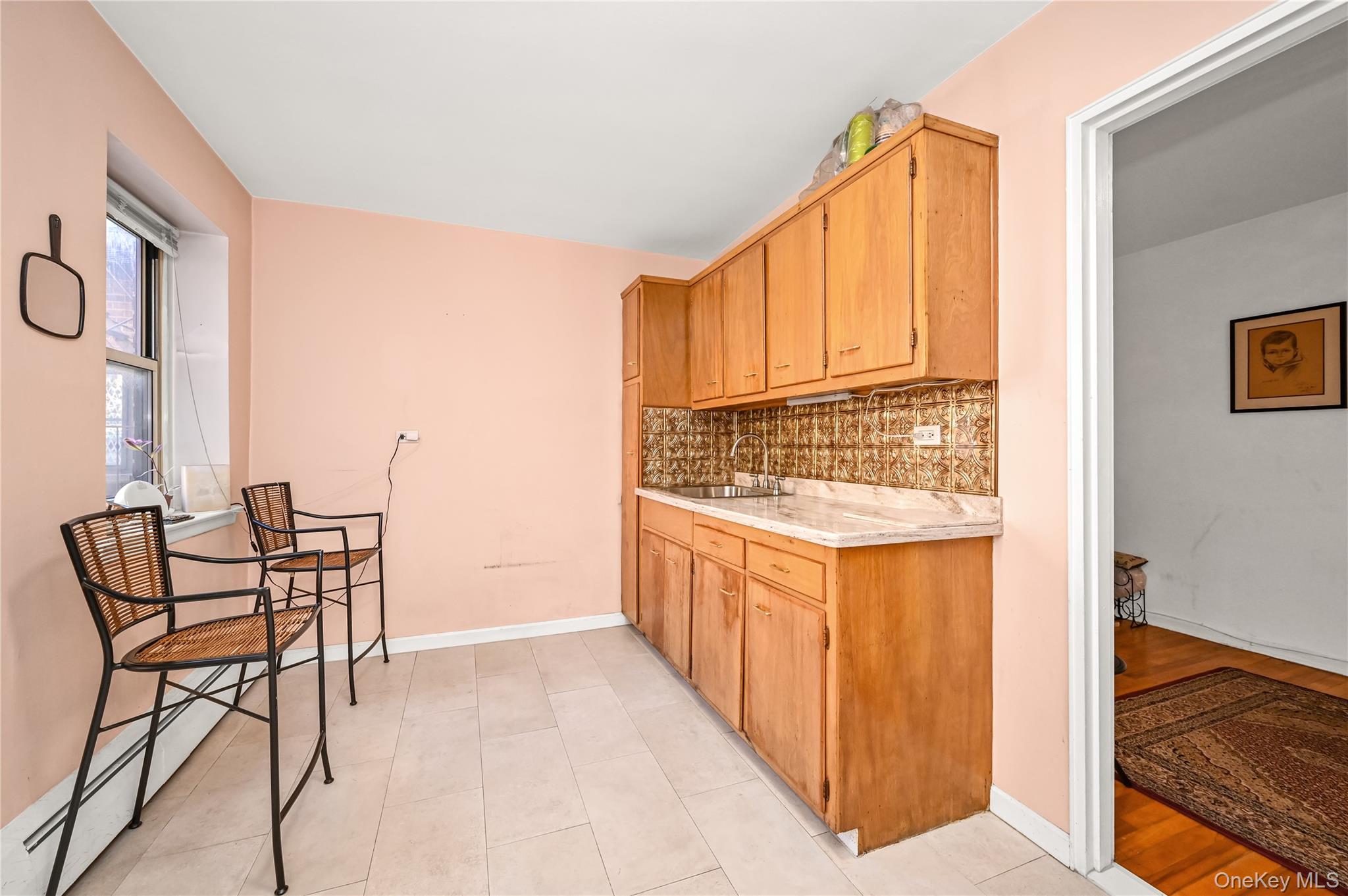 99-10 60th Avenue, Unit 3B Queens, NY 11368 - Photo 14 of 25 a view of a kitchen from the hallway
