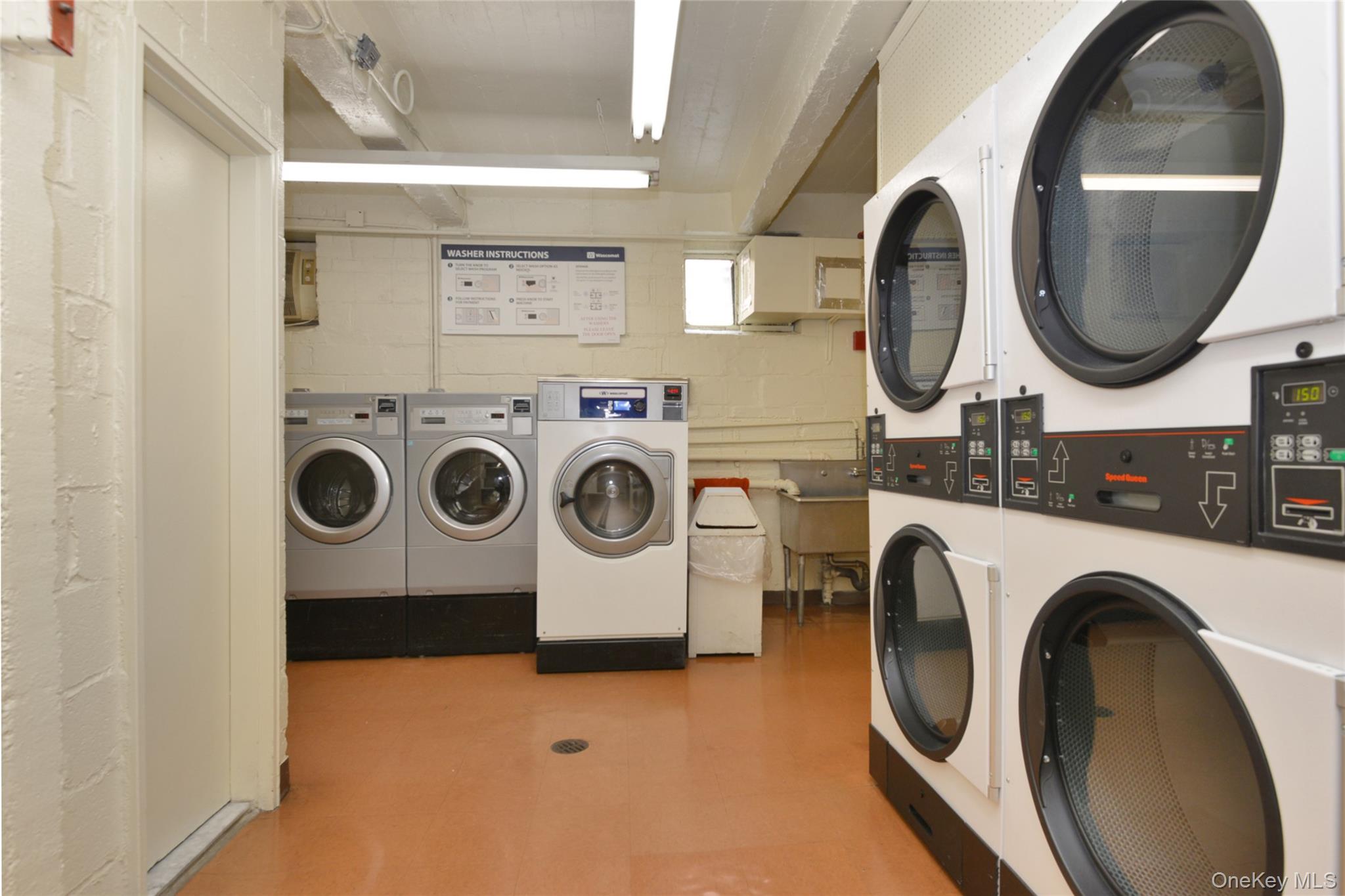 99-10 60th Avenue, Unit 3B Queens, NY 11368 - Photo 19 of 25 a utility room with dryer and washer
