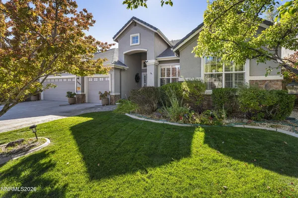 a front view of a house with a yard